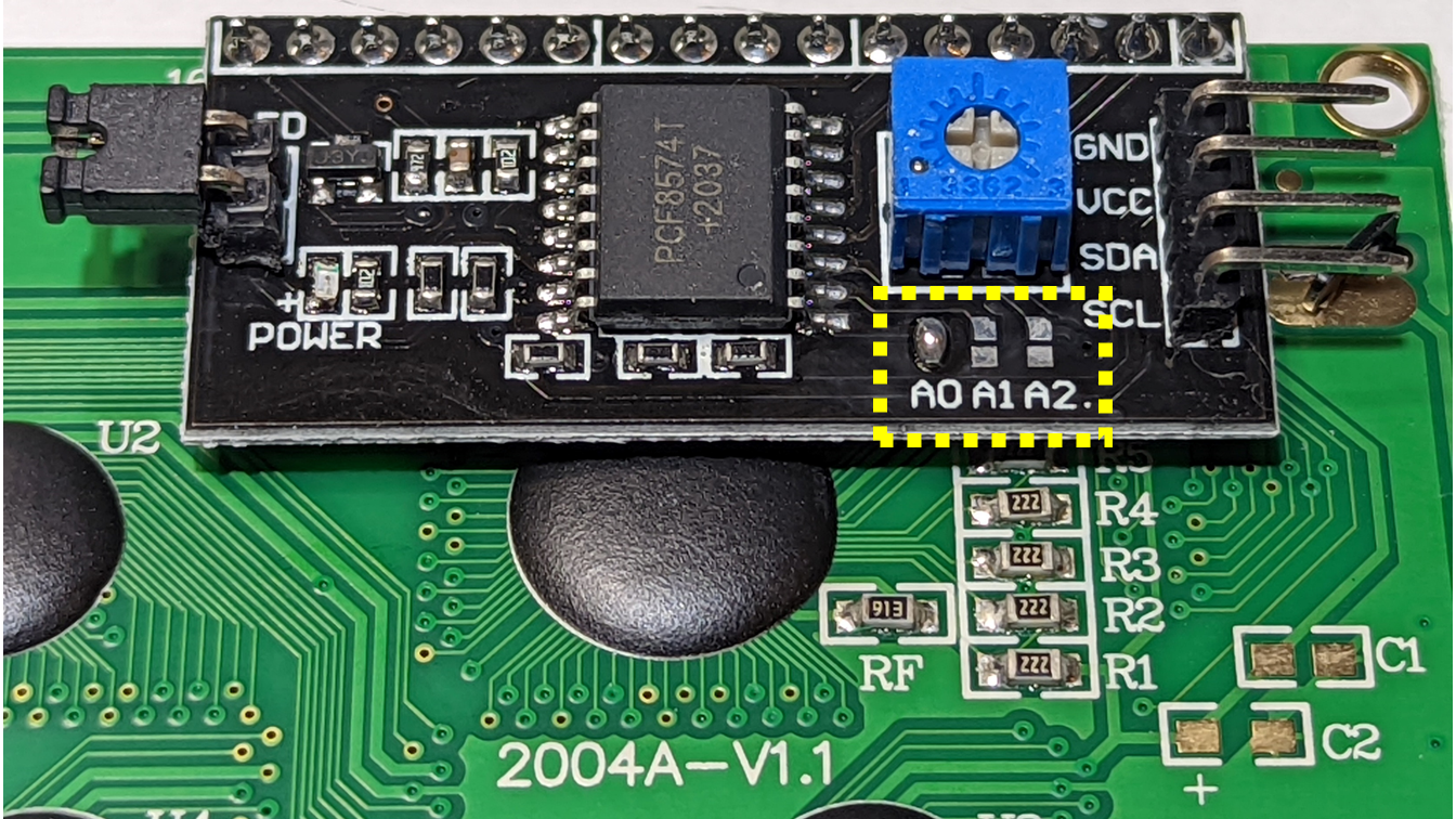 20文字×4行キャラクタLCDの背面。I2C I/F基板の黄色の点線部分がI2Cアドレス設定用の ソルダジャンパ パターン